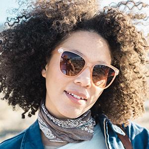 close up of woman wearing sunski camina sunglasses