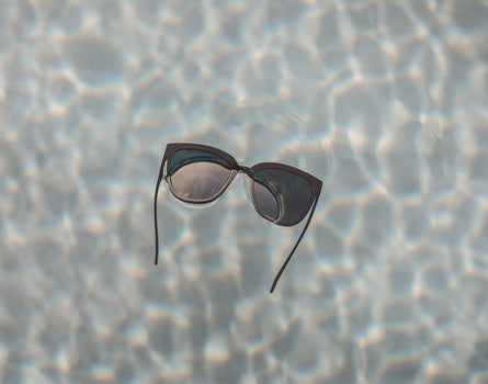 sunski camina sunglasses floating in pool