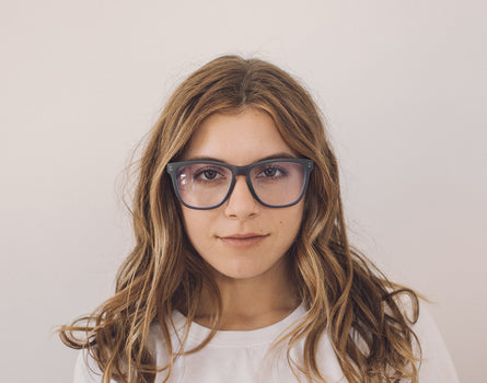 girl wearing sunski classic bluelight glasses
