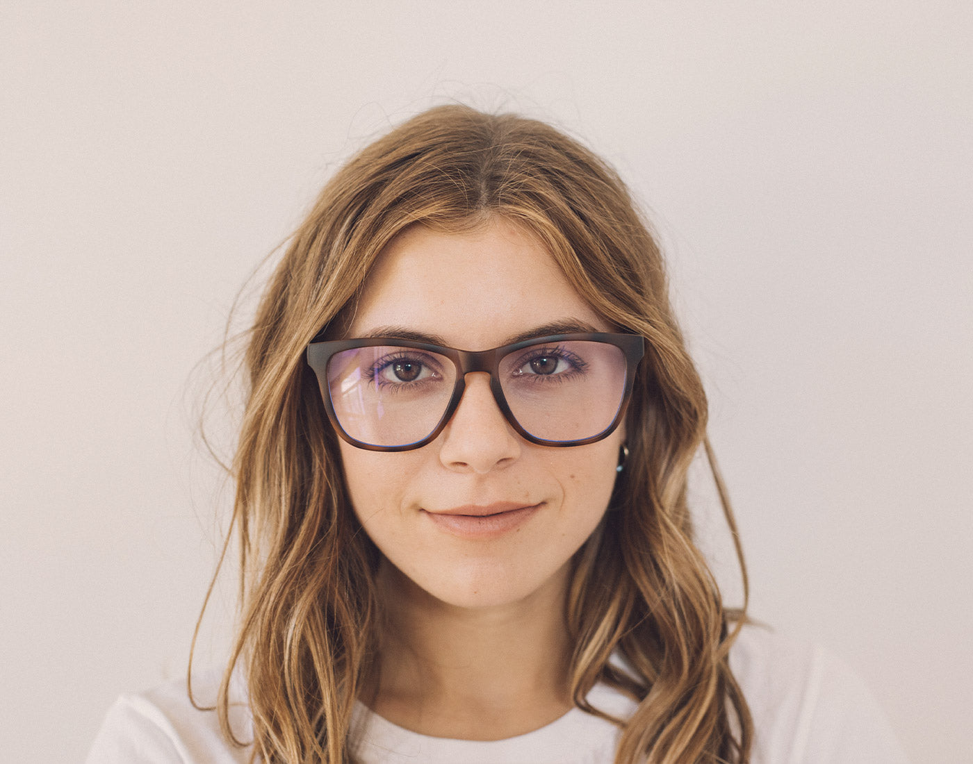 front angle of girl wearing sunski classic bluelight glasses