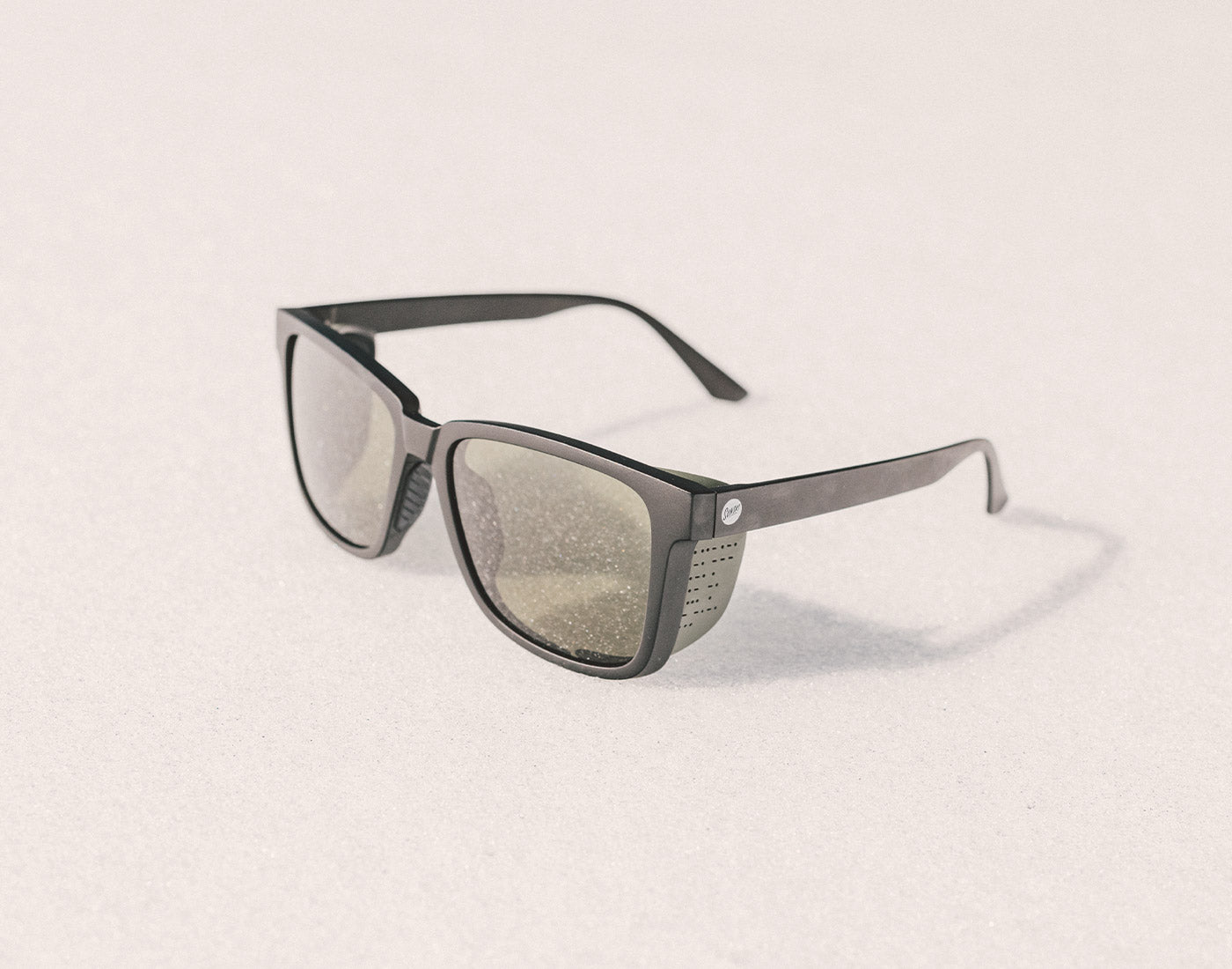 sunski couloir sunglasses in the snow