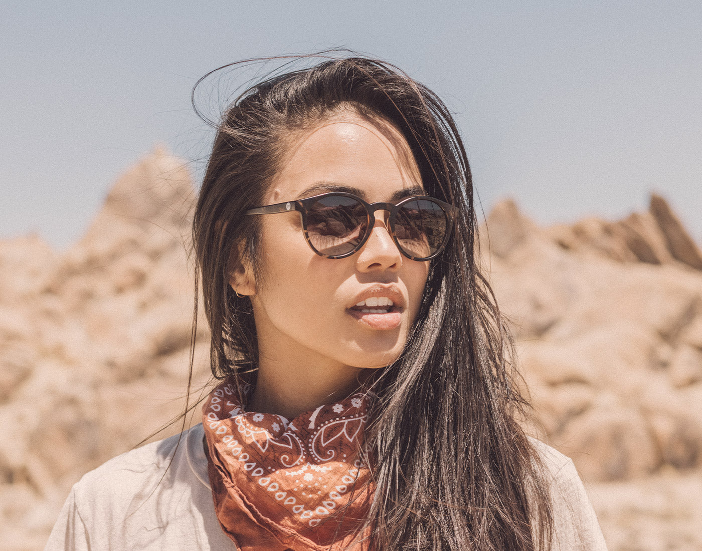girl looking to the side wearing sunski dipsea sunglasses