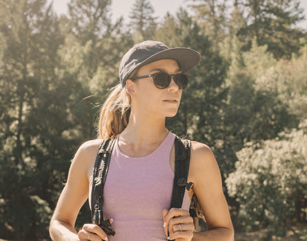 girl hiking wearing sunski dipsea sunglasses