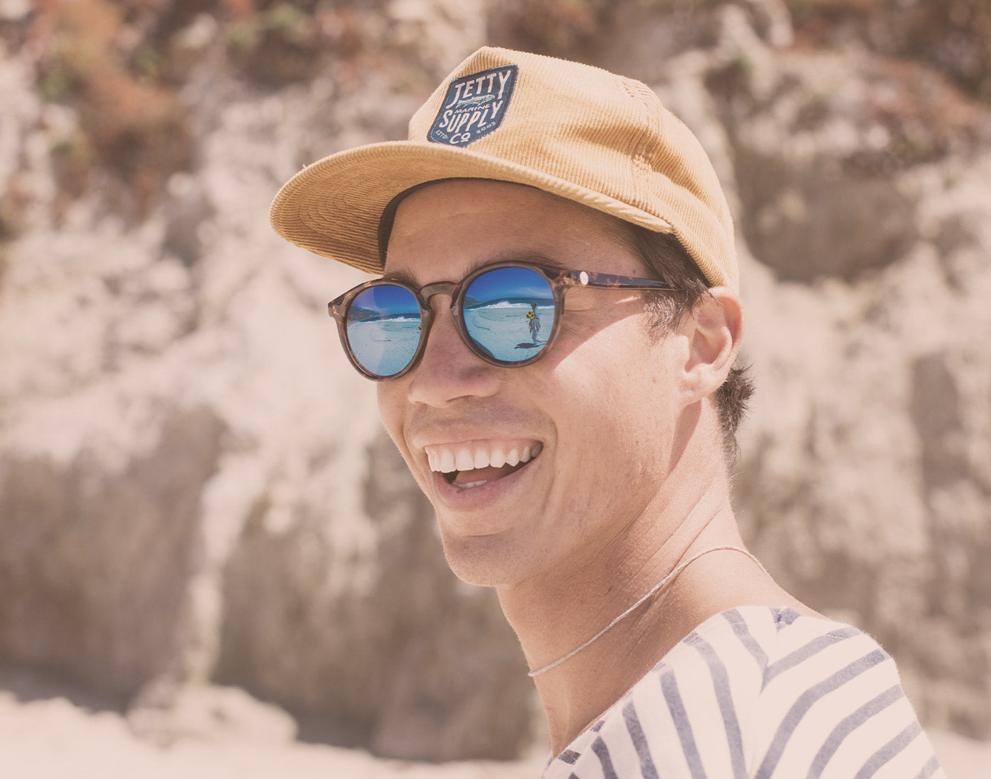 guy laughing wearing sunski dipsea sunglasses
