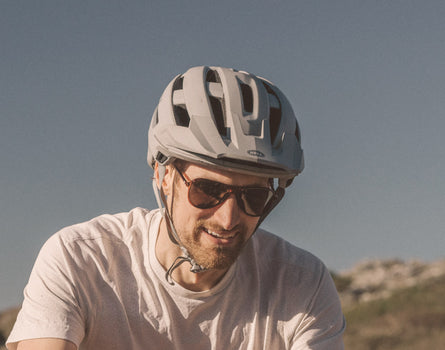 guy in a bike helmet wearing sunski foxtrot sunglasses