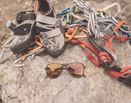 sunski foxtrot sunglasses laying amongst climbing gear