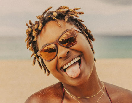 woman sticking her tongue out wearing sunski headland sunglasses