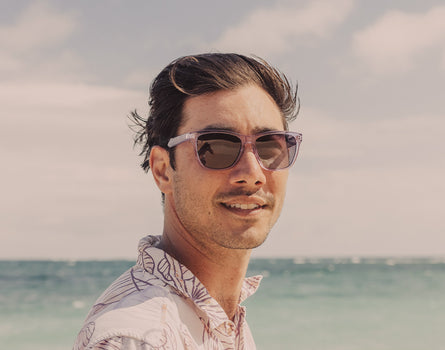 guy on the beach wearing sunski headland sunglasses