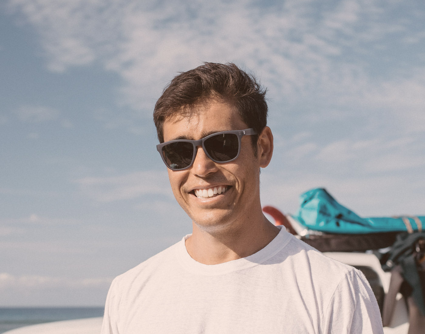 guy smiling wearing sunski headland sunglasses