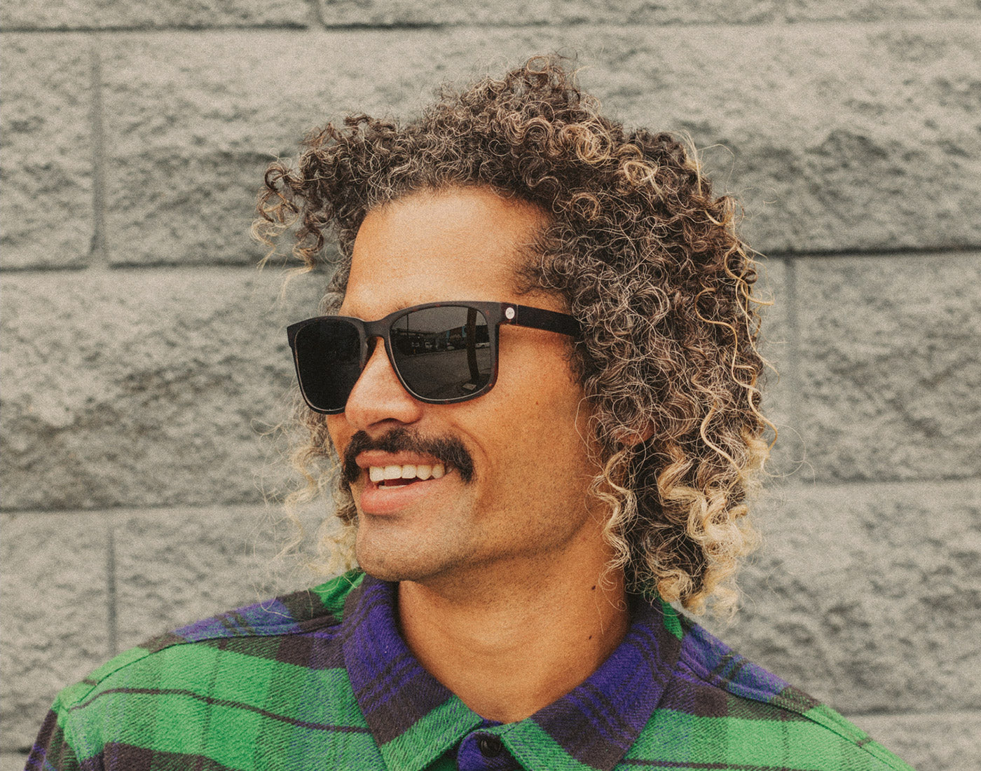 profile of man wearing sunski kiva sunglasses