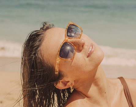 girl basking wearing sunski madrona sunglasses