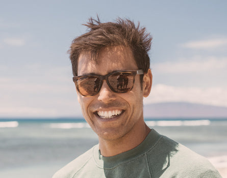 guy smiling wearing sunski madrona sunglasses