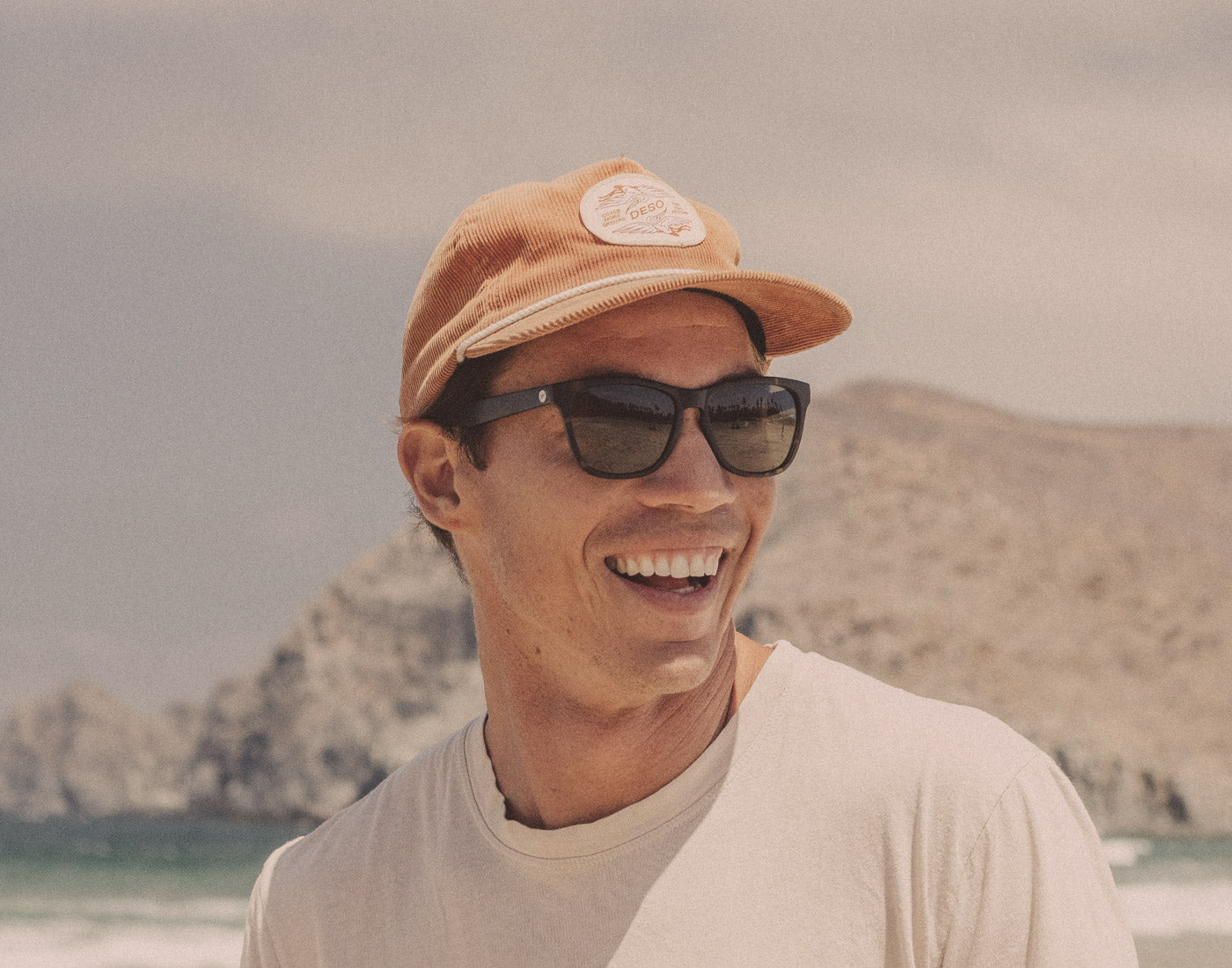 guy laughing wearing sunski madrona sunglasses