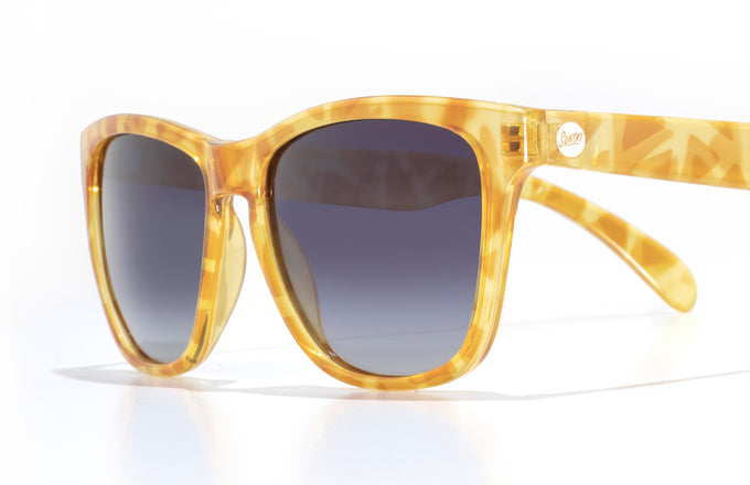 sunski madrona blonde tortoise ocean cloe up three quarter angle