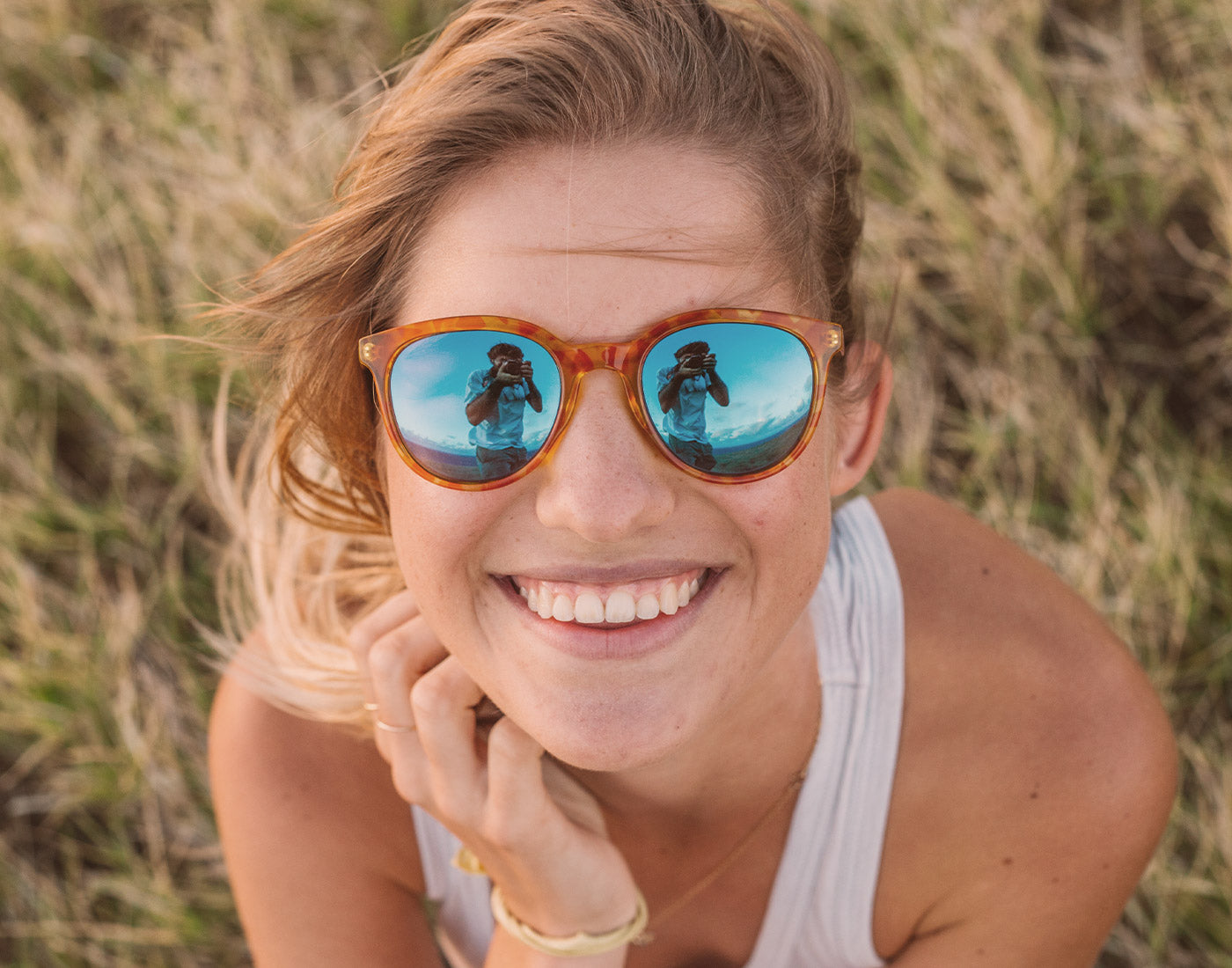 girl smiling wearing sunski makani sunglasses