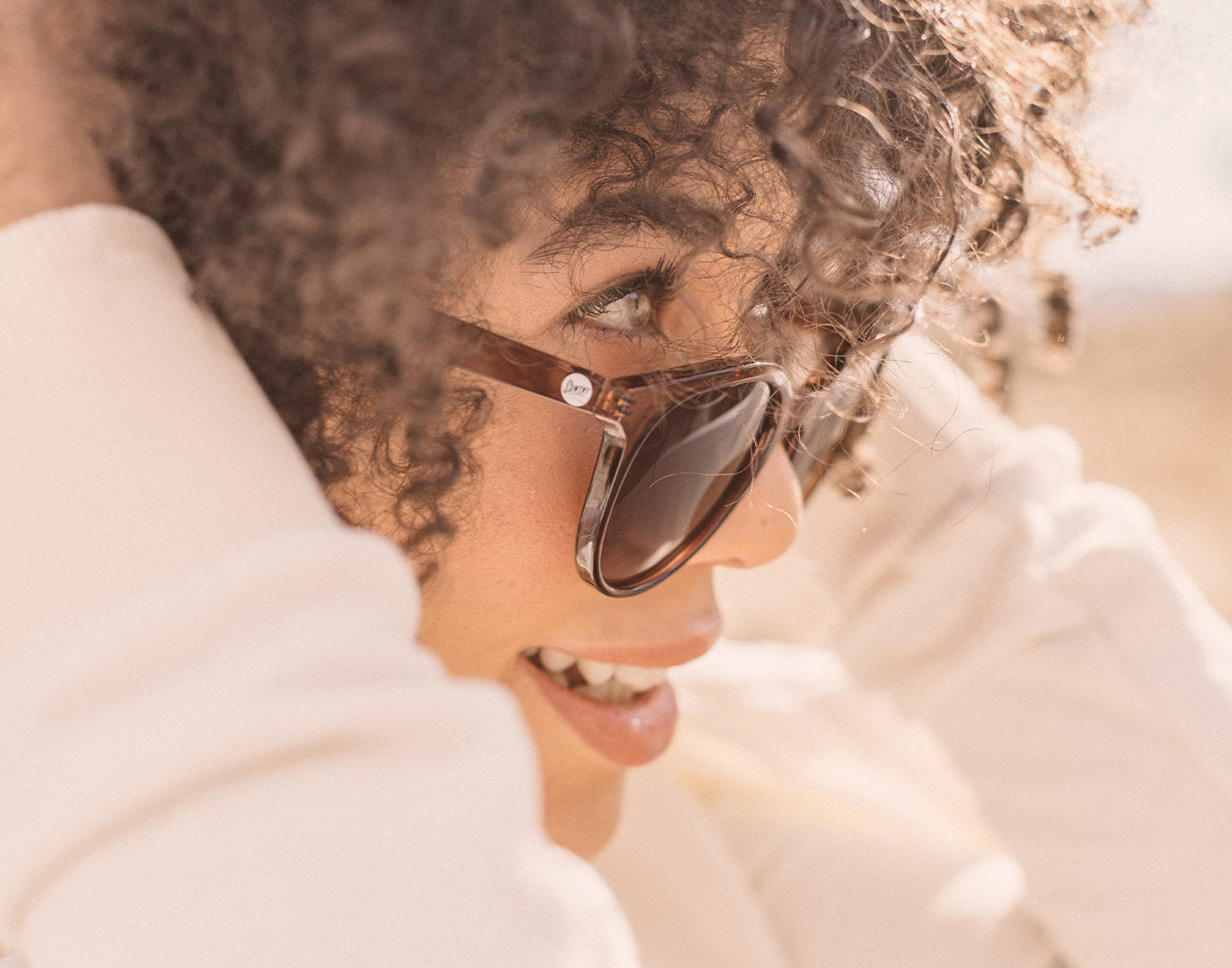 close up profile of girl wearing sunski makani sunglasses