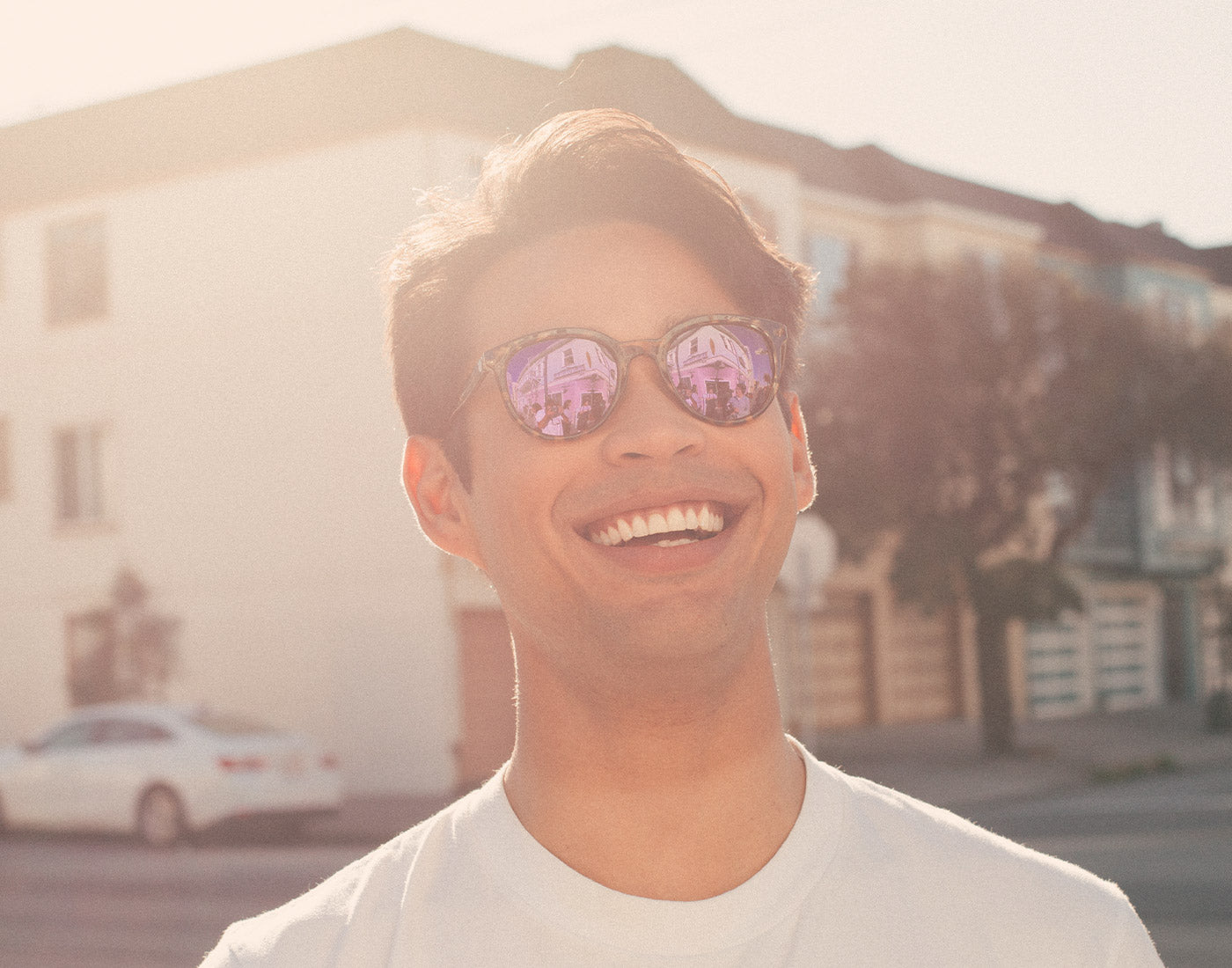 guy smiling wearing sunski makani sunglasses