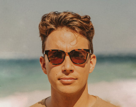 straight on shot of man wearing sunski miho sunglasses