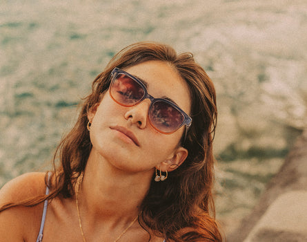 woman leaning head back wearing sunski miho sunglasses