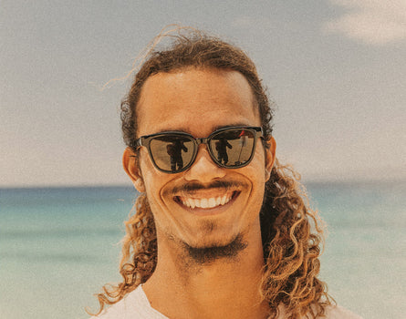 man smiling wearing sunski miho sunglasses
