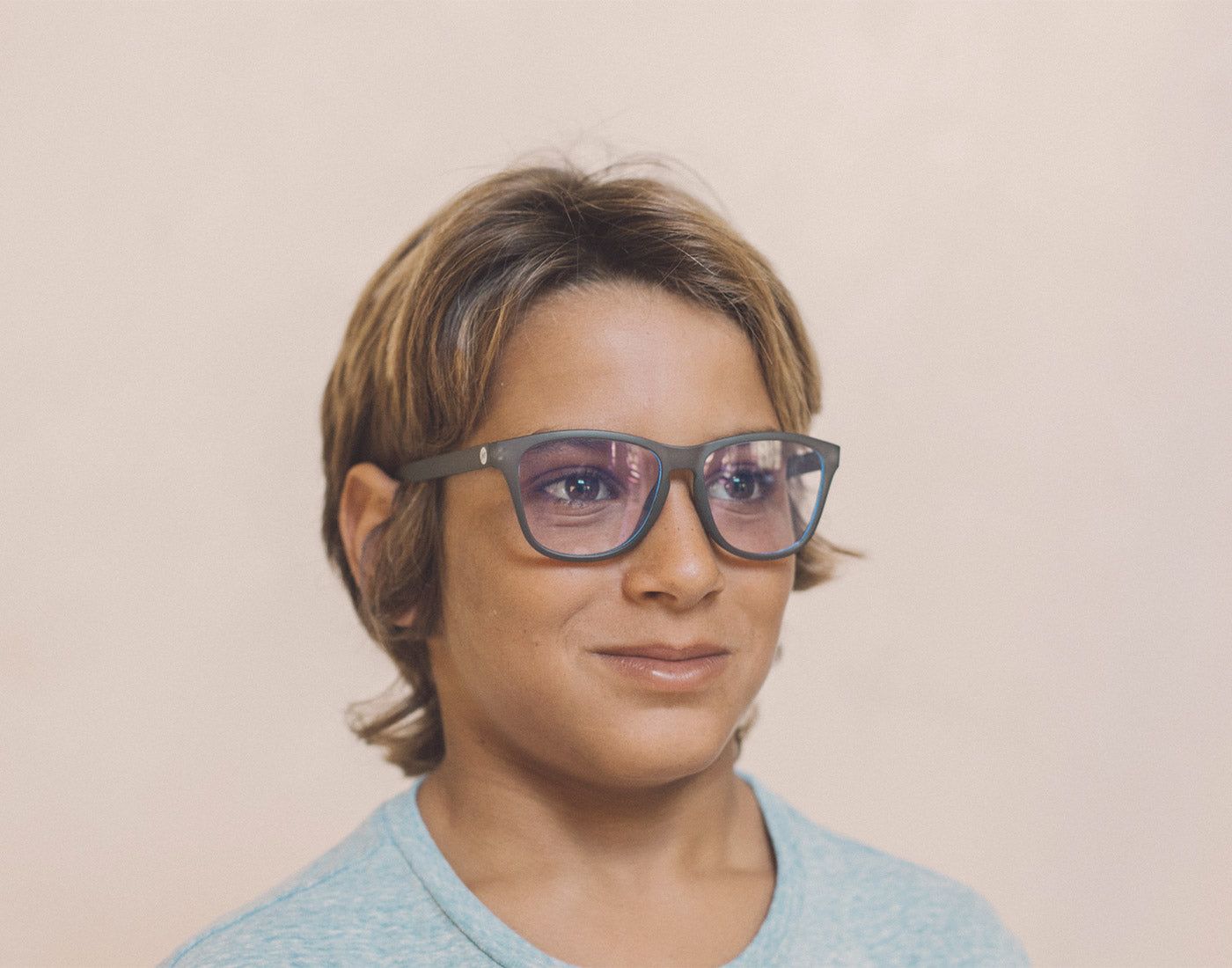 boy wearing sunski mini headland bluelight glasses