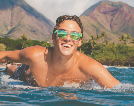 guy surfing wearing sunski original sunglasses