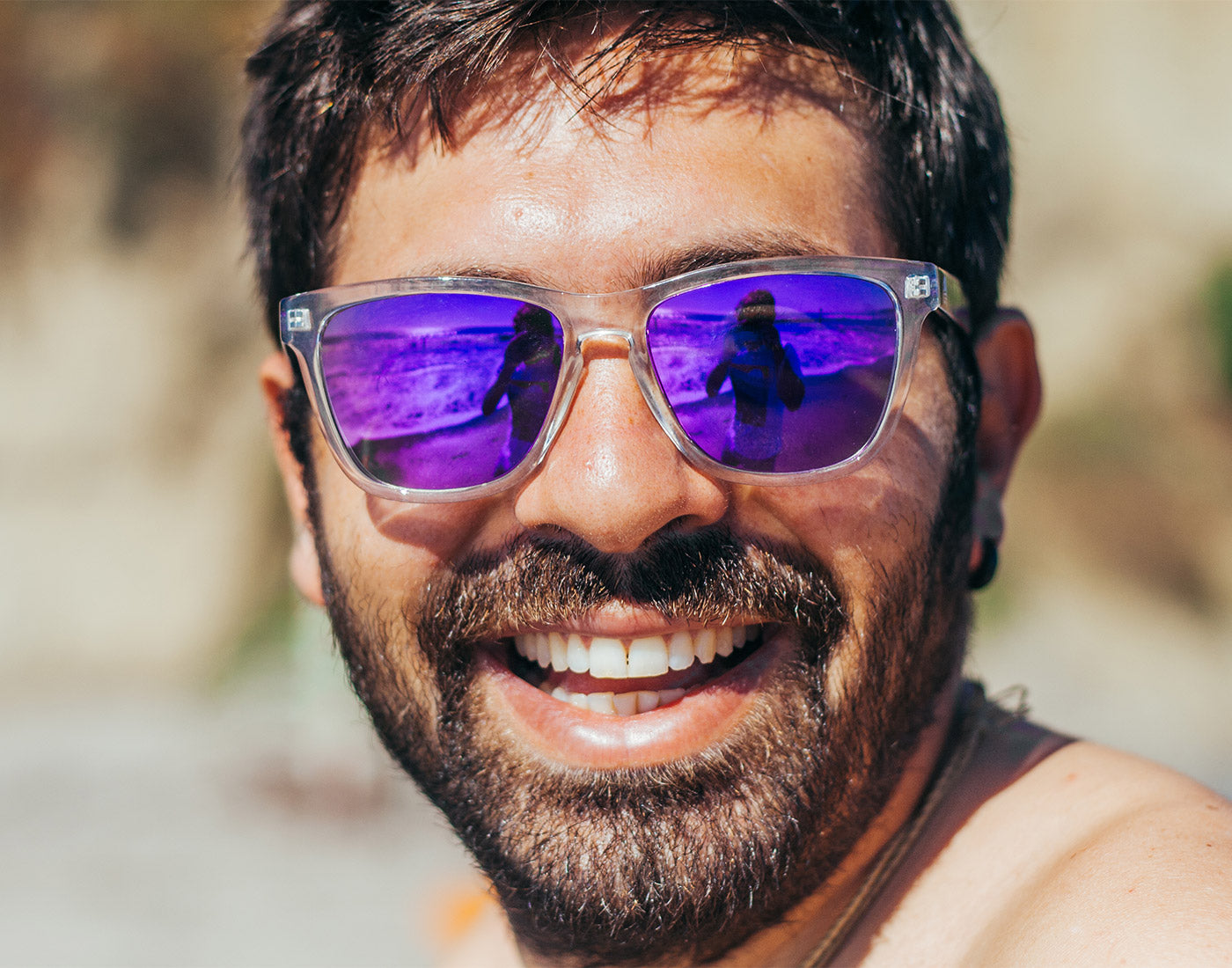 guy smiling wearing sunski original sunglasses