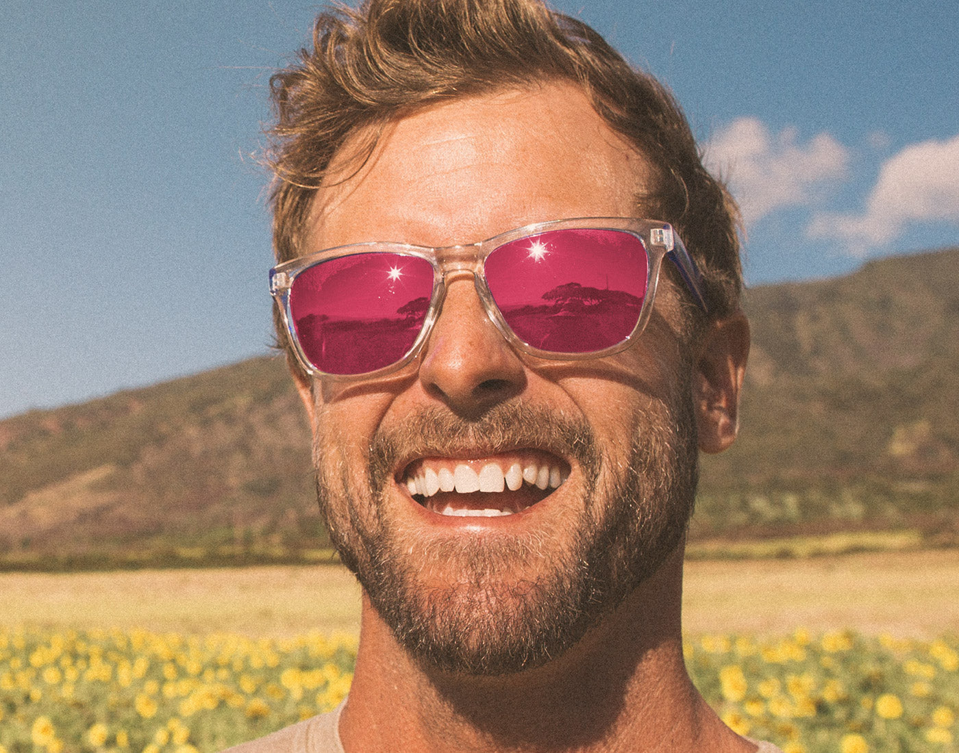 guy smiling wearing sunski original sunglasses