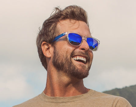 guy laughing wearing sunski original sunglasses