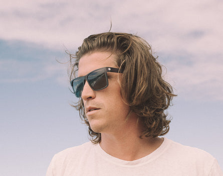 guy looking to the side wearing sunski puerto sunglasses