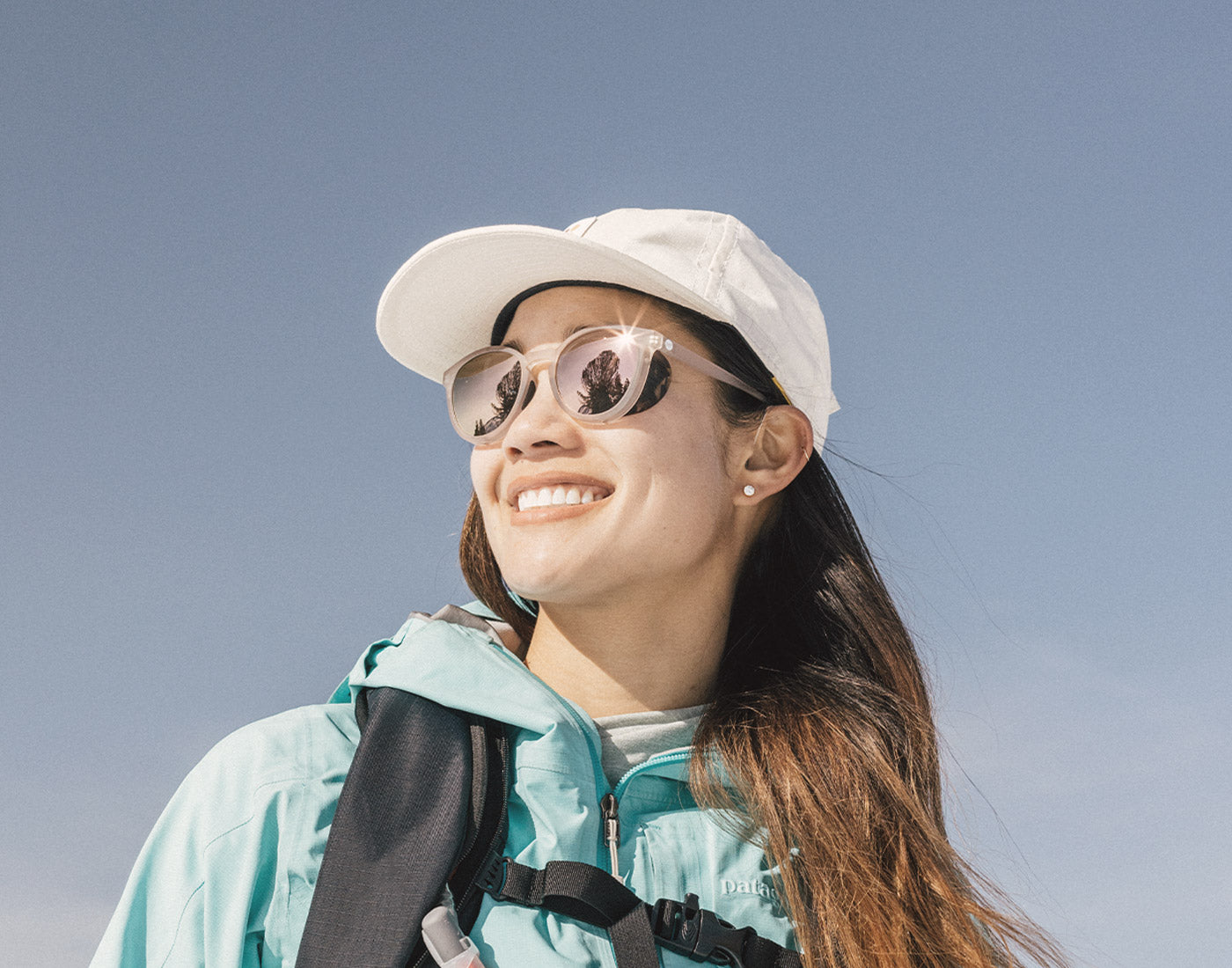 low angle shot of girl wearing sunski tera sunglasses