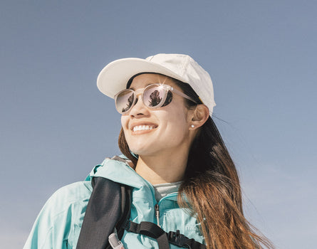 low angle shot of girl wearing sunski tera sunglasses