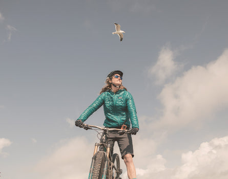girl on a bike wearing sunski topeka sunglasses