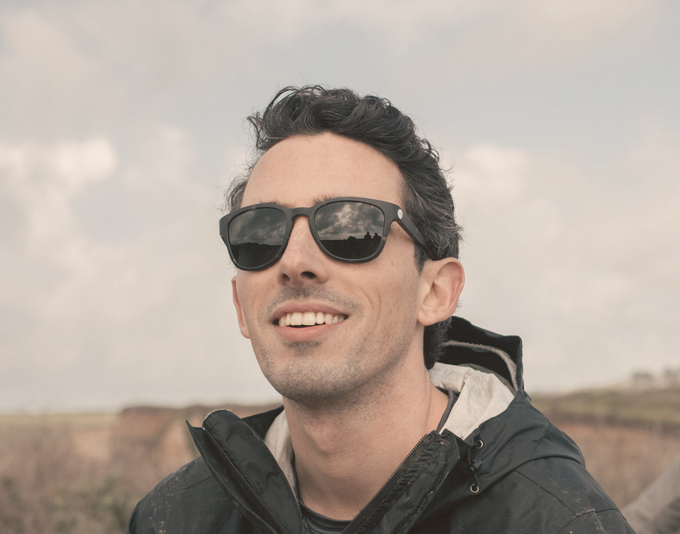 guy smiling wearing sunski topeka sunglasses