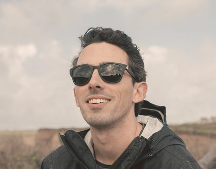 guy smiling wearing sunski topeka sunglasses