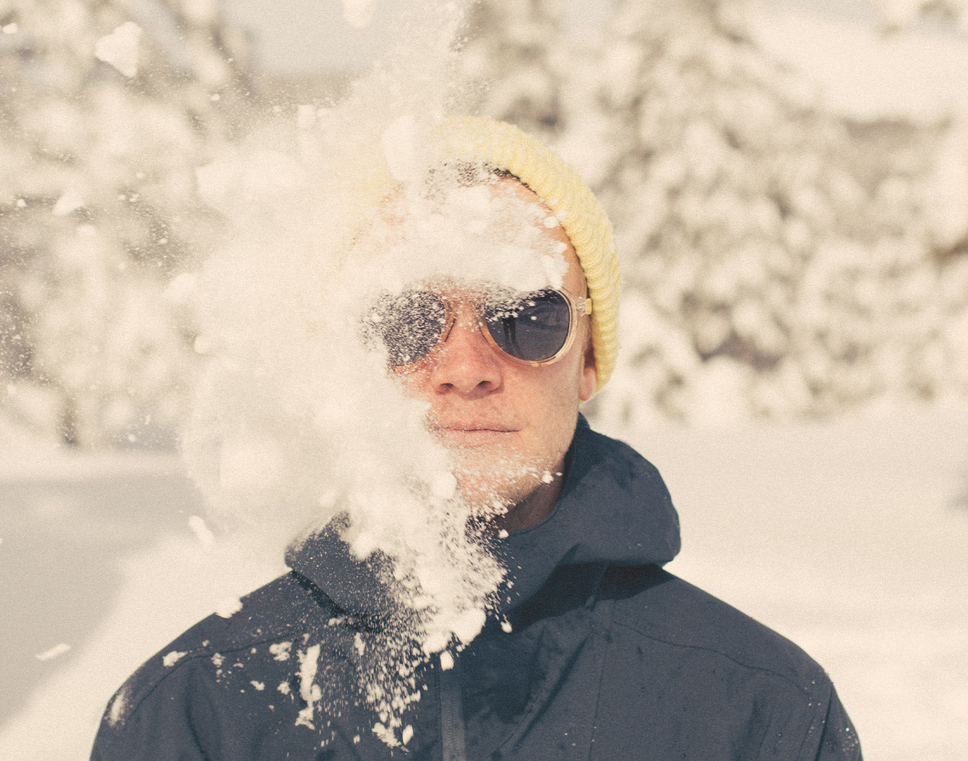 guy getting hit by a snowball wearing sunski treeline sunglasses