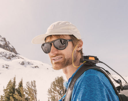 guy on a snowy mountain wearing sunski treeline sunglasses