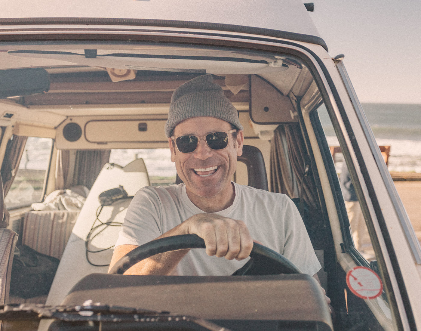 guy driving a car wearing sunski ventana sunglasses