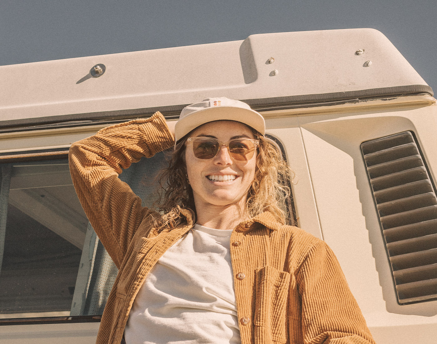 girl leaning against car wearing sunski ventana sunglasses