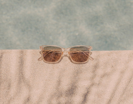 sunski ventana sunglasses on side of pool 