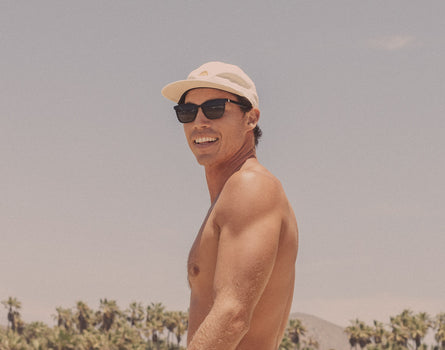 guy in a hat wearing sunski ventana sunglasses