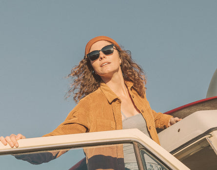 girl coming out of car wearing sunski ventana sunglasses