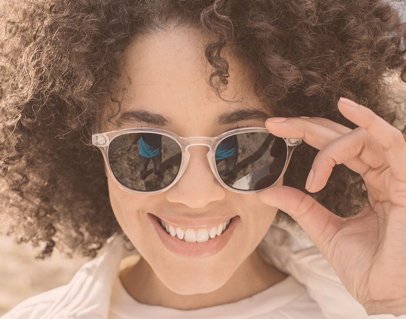 girl smiling wearing sunski yuba sunglasses