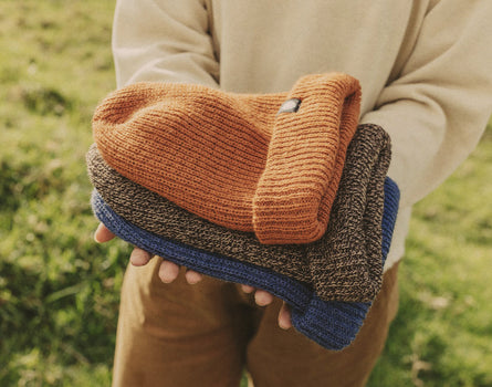 hands holding all three sunski shoulder season beanies