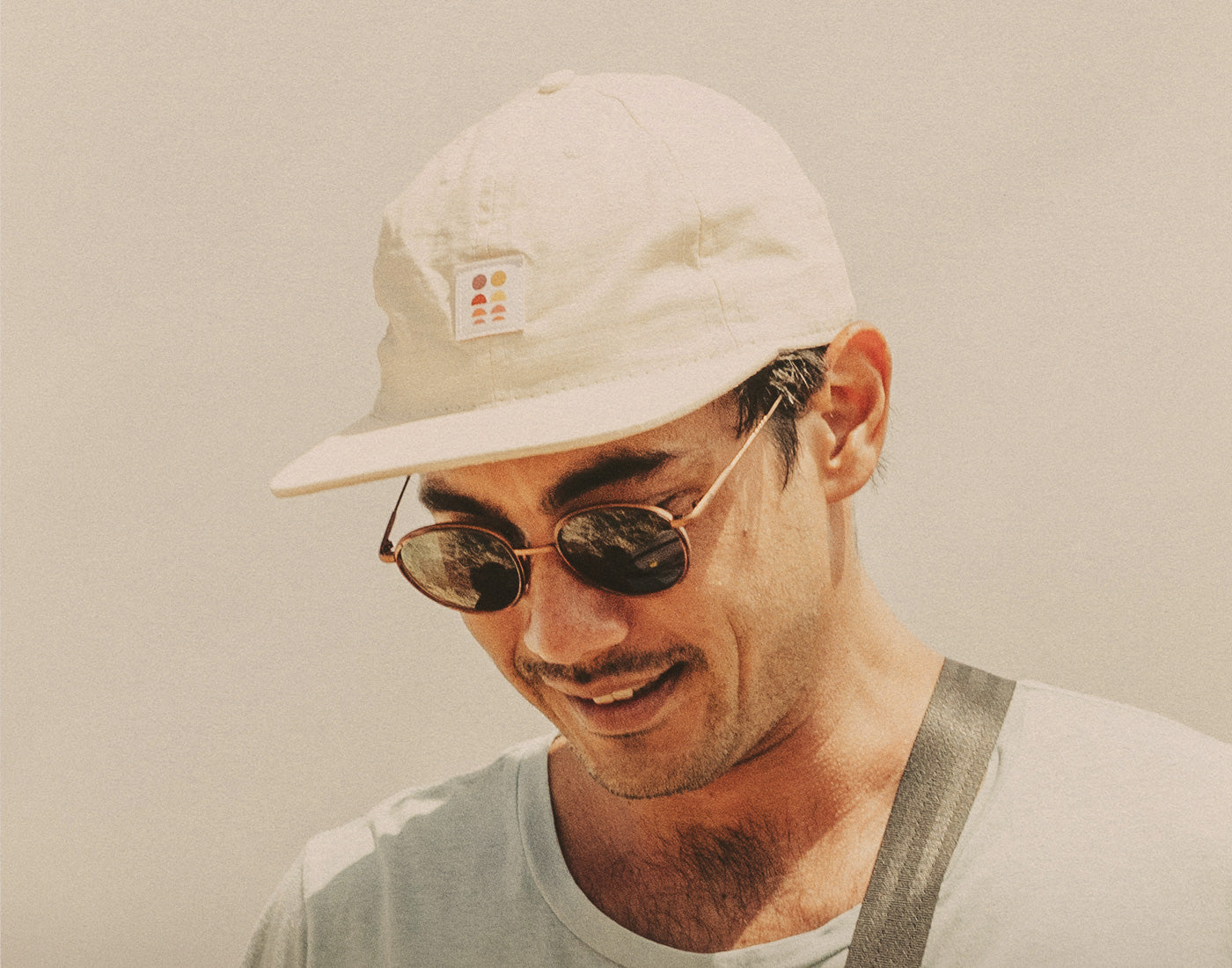 man wearing sunski sun up hat