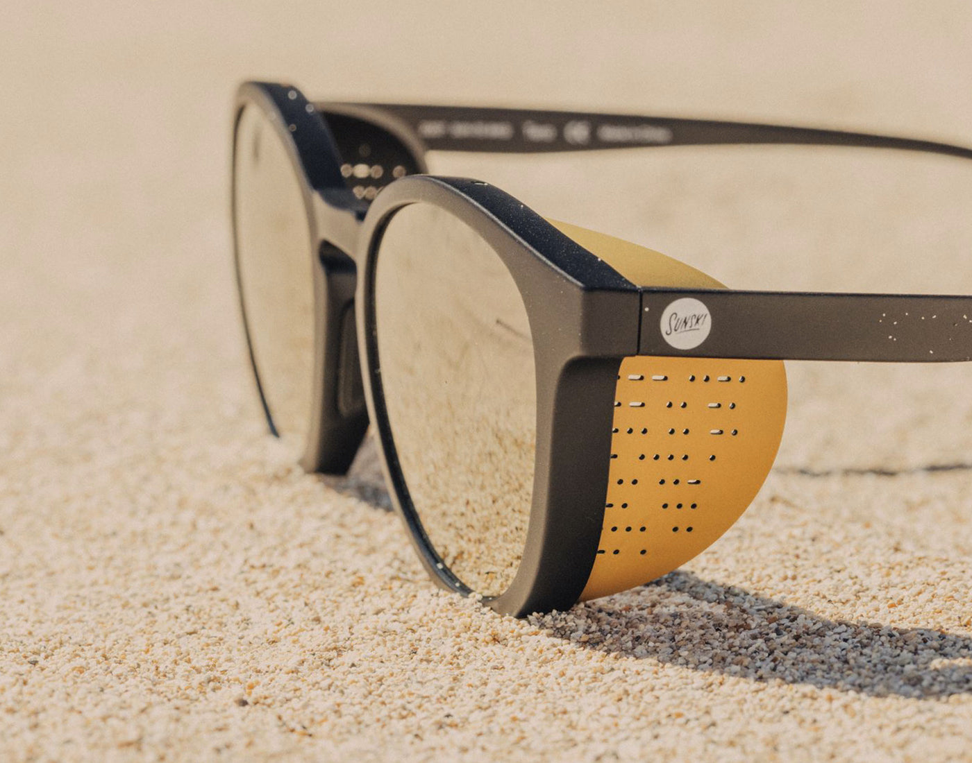 sunski tera sun shields on a pair of sunski tera black gold sunglasses
