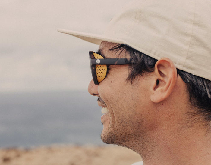 STORY profile shot of man with sunglasses and sunski treeline sun shields