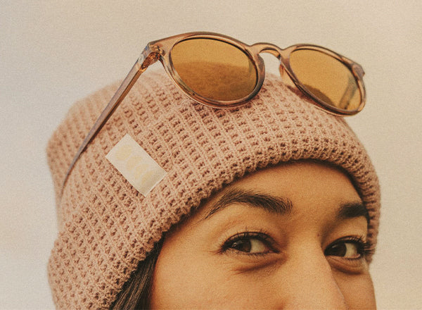 close up of girl wearing sunski winter sun beanie
